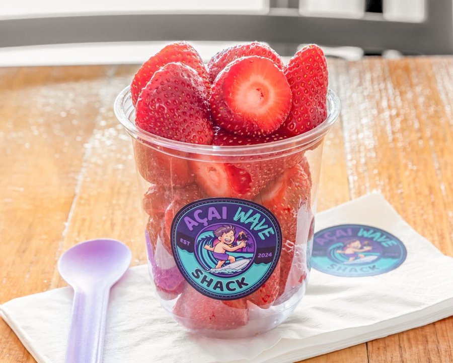 Cup filled with fresh strawberries